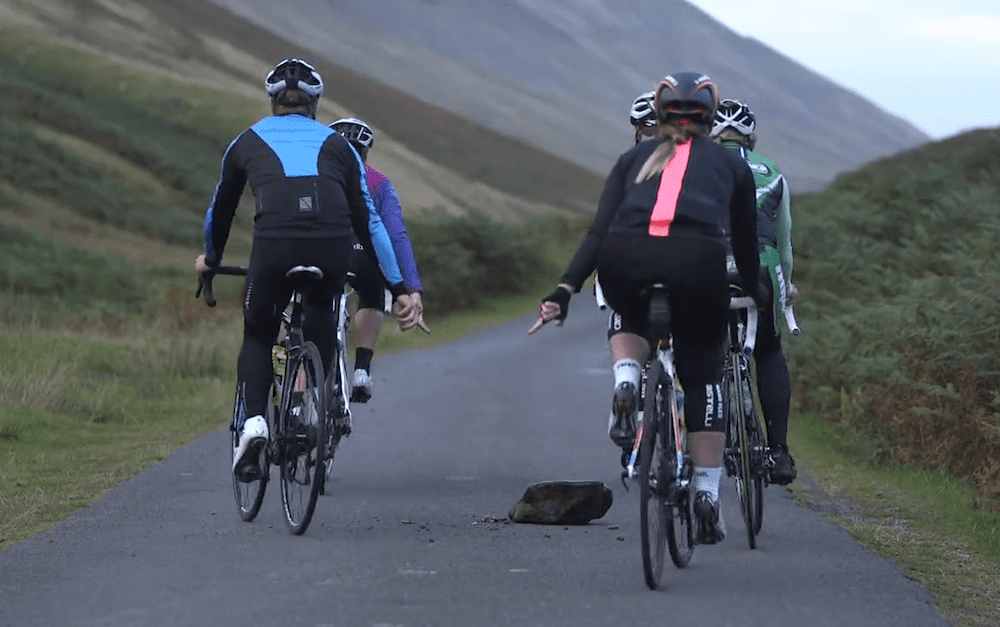 Cyclists Pointing Out Hazards