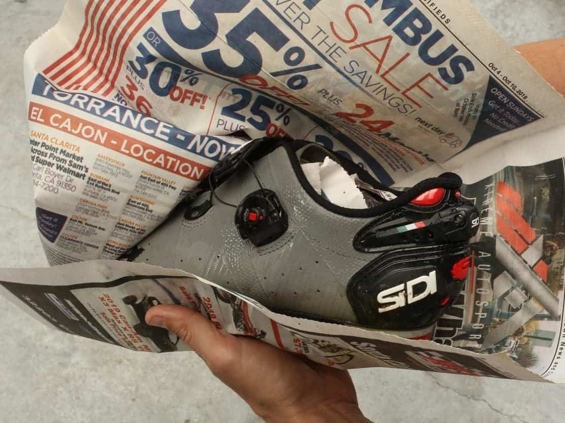 Cycling shoes and old newspaper